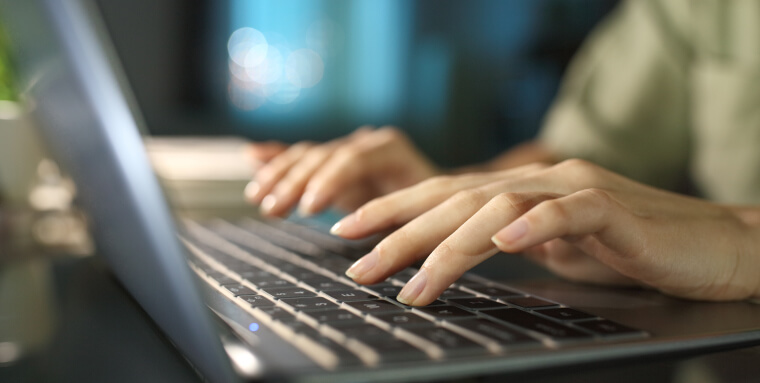 Fingers typing on a keyboard