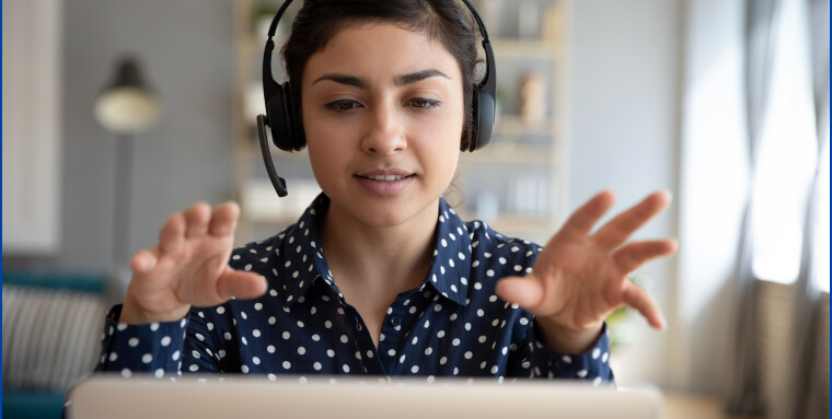 Person talking on a virtual meeting using a headset