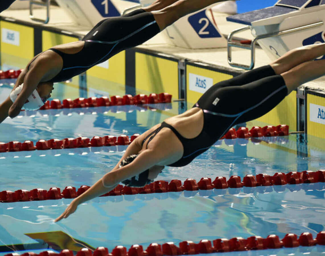 Anna diving to a pool